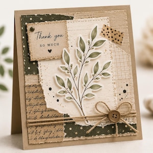 May include: A handmade greeting card with a botanical theme. The card features a layered design with torn paper, a sprig of green leaves, and the text "Thank you so much." A twine bow and button add a rustic touch.