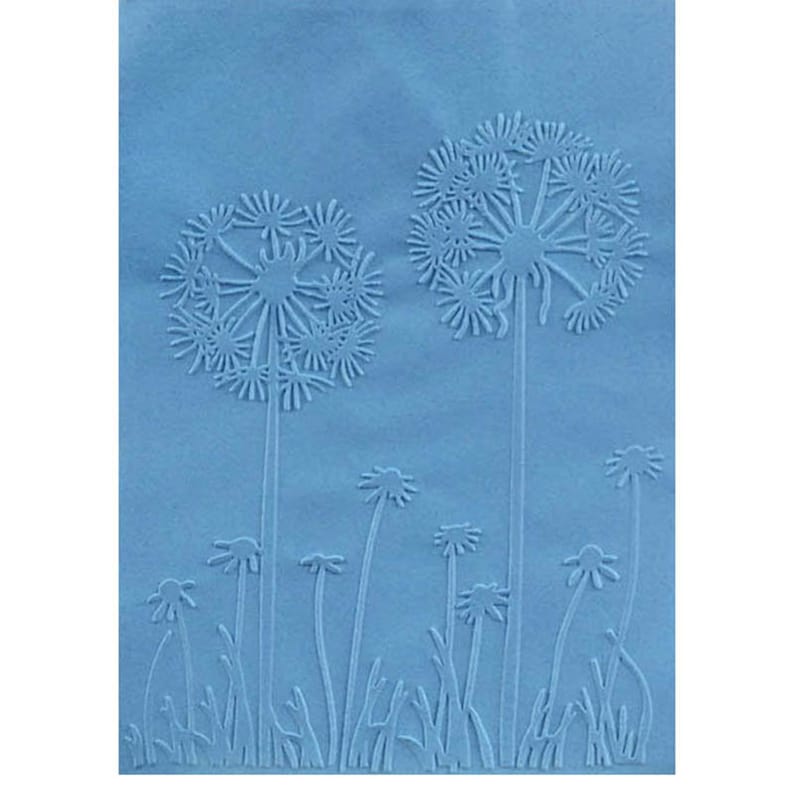 May include: A light blue embossed paper featuring a dandelion design. Two large dandelions are in the background, with smaller ones and blades of grass in the foreground. The image has a textured appearance.