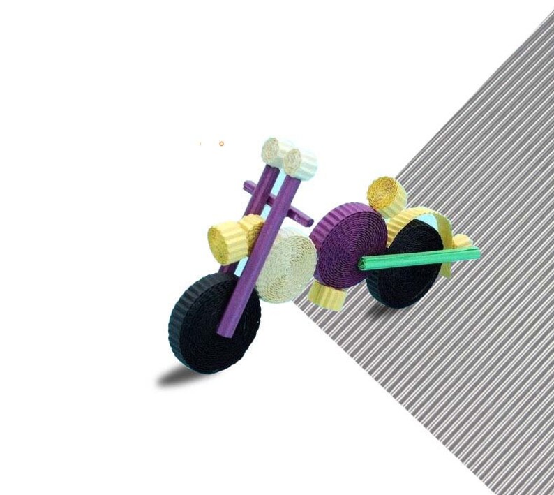 May include: A purple, yellow, and black paper quilling motorcycle. The motorcycle is made of rolled paper and has a green paper handlebar.