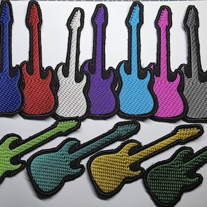May include: A collection of eleven embroidered guitar patches in various colours including blue, red, white, purple, light blue, pink, grey, lime green, teal, yellow, and dark green. Each patch features a black stitched border and textured surface.