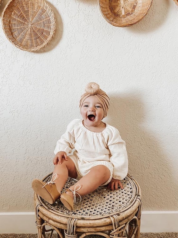 beige baby clothes