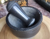 Vintage mortar with pestle made of granite natural stone spice-crusher grain grater spice mortar