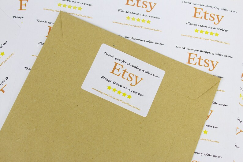 May include: White sticker with the text "Thank you for shopping with us on Etsy. Please leave us a review." and five yellow stars. The sticker is on a brown paper envelope.
