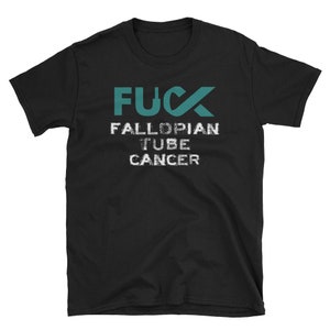 May include: Black t-shirt with the text "FUCK FALLOPIAN TUBE CANCER" in teal and white. The word "FUCK" is in a bold, sans-serif font, with the "U" replaced by a teal fallopian tube graphic.