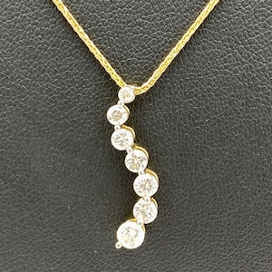 14k Yellow Gold Journey Pendant with 7 Graduated Diamonds
