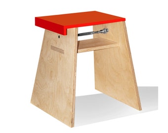 stool with minimalist design in orange Corian and wood. Handmade in Italy