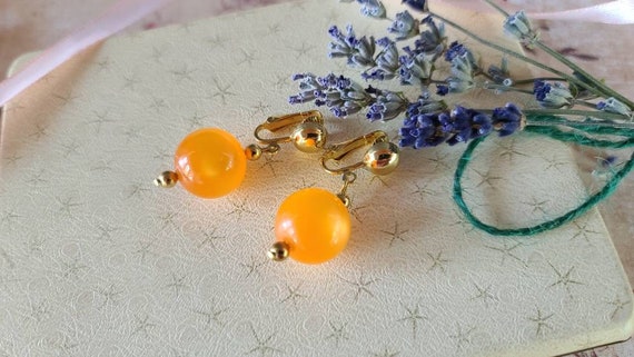 Celebrity Orange Dangling Clip-on Earrings - image 6