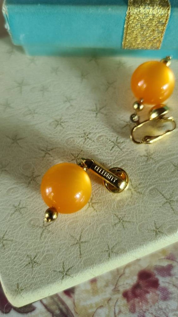 Celebrity Orange Dangling Clip-on Earrings - image 10