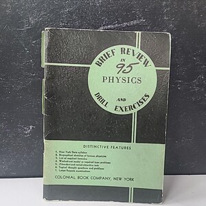 May include: A vintage physics textbook titled "Brief Review in 95 Physics Drill and Exercises." The cover is black with a green circular design and text. The book includes "Distinctive Features" and is published by Colonial Book Company, New York.