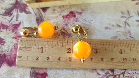 Celebrity Orange Dangling Clip-on Earrings - image 7
