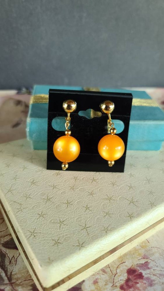 Celebrity Orange Dangling Clip-on Earrings - image 2