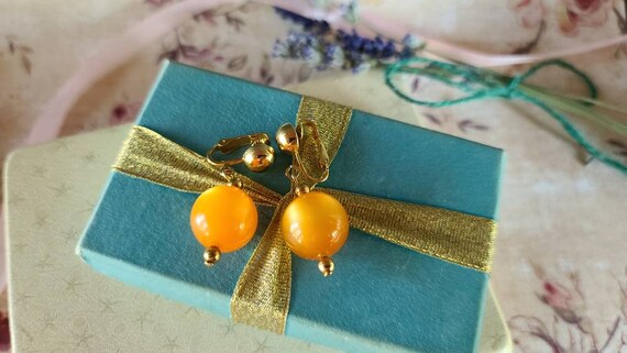 Celebrity Orange Dangling Clip-on Earrings - image 3