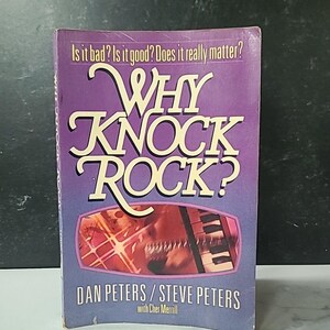 May include: A book titled "Why Knock Rock?" with a purple cover. The title is in large, white, stylized letters. The cover also features the text "Is it bad? Is it good? Does it really matter?" and the names Dan Peters and Steve Peters.