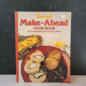 May include: A vintage Sunset Make-Ahead Cook Book for entertaining and everyday meals. The cover features a photo of a red plate with a dish of sliced meat, onions, and wild rice.