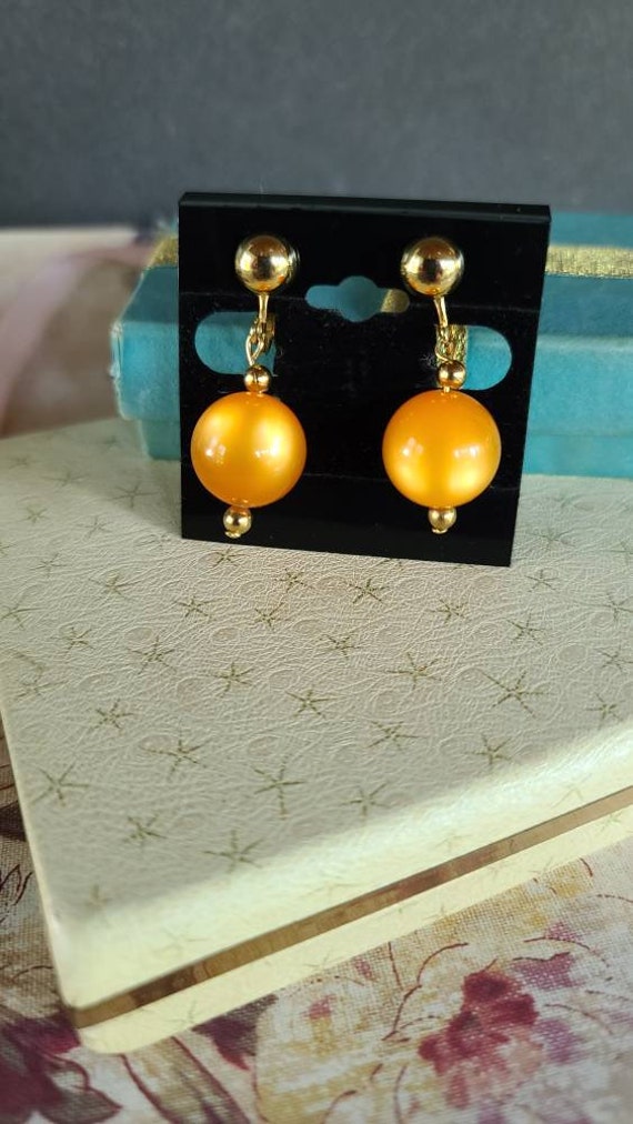 Celebrity Orange Dangling Clip-on Earrings - image 4