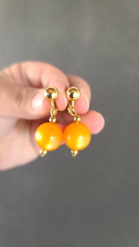 Celebrity Orange Dangling Clip-on Earrings - image 5