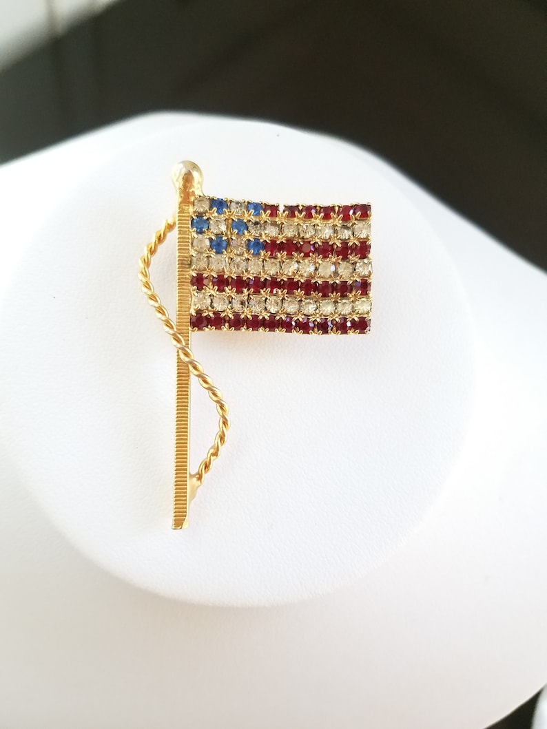 Vintage American Flag pin offered by VintageChicFinds on Etsy. Come be inspired by 4th of July Tablescapes, Patriotic Decor & USA Finds: Happy Birthday, America in case you're in the mood for American flag and red, white, and blue festive finds.