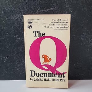May include: Vintage paperback book titled "The Q Document" by James Hall Roberts. The cover features a large pink "Q" with a silhouette of a person running. The book is a Fawcett Crest Book, with the price of 95 cents.