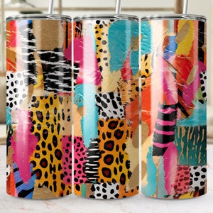 May include: Three stainless steel tumblers with colorful abstract patterns. The patterns include animal prints, stripes, and geometric shapes. The tumblers are a vibrant mix of pink, orange, yellow, blue, green, and black.