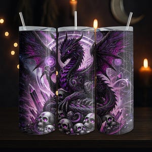 May include: Three stainless steel tumblers with a fantasy dragon design. The dragon is black and purple, with a detailed wing and skull design. The tumblers have a straw and a silver lid. The background is dark with purple accents.