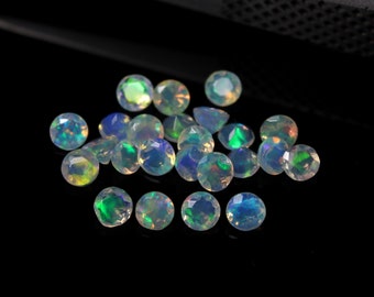 May include: A group of iridescent opal gemstones, with a variety of colors, including green, blue, and white, on a black background.