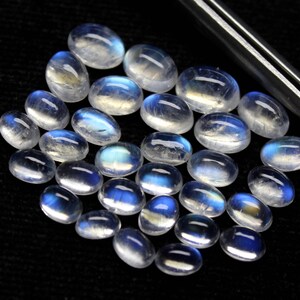 30 stuks AAA-kwaliteit regenboog maansteen blauw flitsvuur maat 3 x 5 tot 5 x 8 mm ca. mixgrootte kavel ovaal cabochon code GM18