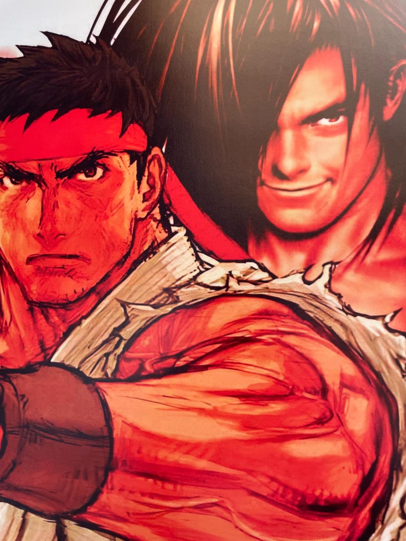 May include: A close-up of two men's faces. The man on the left has short black hair, a red headband, and a serious expression. The man on the right has long black hair, a smirk, and is wearing a torn white shirt.