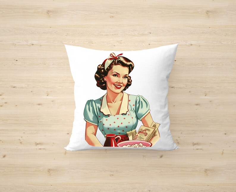 May include: A white pillow with a vintage illustration of a woman in a blue and white polka dot dress holding a pitcher and a bowl of popcorn. The woman is smiling and has a red bow in her hair.