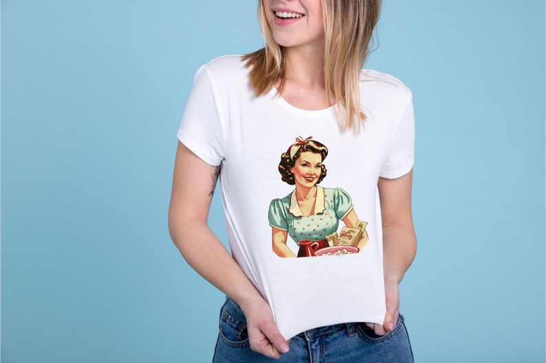 May include: White t-shirt with a vintage illustration of a woman in a blue and white polka dot dress holding a bowl of popcorn and a box of cereal. The text on the cereal box reads "Sugar Smacks".