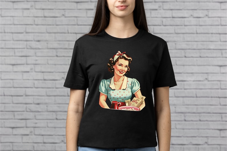 May include: A black t-shirt with a vintage illustration of a woman in a blue and white polka dot dress holding a bowl of popcorn and a cup. The woman is smiling and has a red bow in her hair.