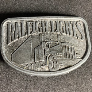 Vintage Raleigh Lights Cigarettes Semi-Truck Trucking Belt Buckle