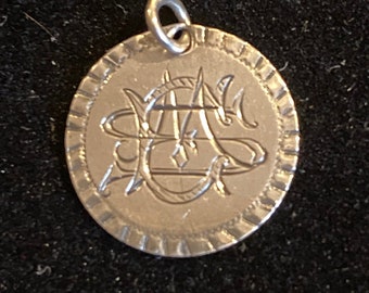 Love/Friendship token/charm from 1855 featuring the monogram ESM,MSE,SME in Victorian Script