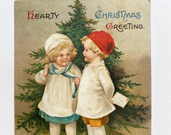 Wonderful antique Christmas postcard by Ellen Clapsaddle in very good condition.