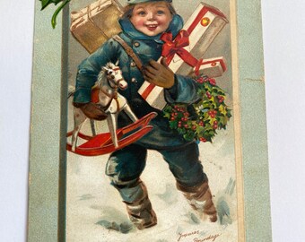 Antique Christmas postcard by Frances Brundage from 1910 it is in fair condition with a slight tear on the right but the image is great.