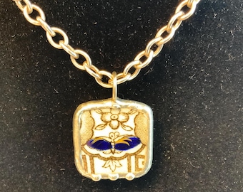Lovely Antique Bone China with Sterling Silver with a 16” Sterling Silver necklace.