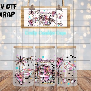 May include: Three glass tumblers with bamboo lids and straws, each featuring a colorful "Poolside Vibes" design. The design includes sunglasses, palm trees, and a drink. A sign above repeats the design. The text "UV DTF WRAP" is in the upper left.