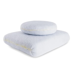 May include: Two light blue, plush, round cushions. The smaller cushion is on top of the larger cushion.