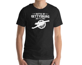 May include: A black t-shirt with a white graphic of a cannon and the text "**BATTLE OF** GETTYSBURG JULY 1-3, 1863"