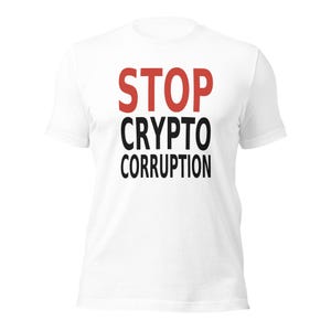 May include: A white short-sleeved t-shirt featuring the text STOP in red capital letters on the top line, followed by CRYPTO and CORRUPTION in black capital letters on the second and third lines, centred on the chest area.