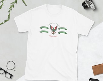 May include: White t-shirt with a graphic design featuring a red and green phoenix emblem, banners with the words "Derry" and "Belfast", and the text "Provisional". A camera and other accessories are visible.
