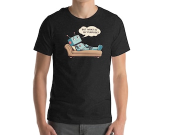 May include: Dark gray t-shirt featuring a cartoon robot lying on a couch, with the text "BUT WHAT IS MY PURPOSE?" in a speech bubble. The robot is light blue with red accents. The couch is brown.
