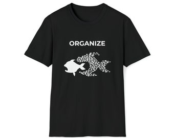 May include: Black t-shirt with a white graphic of a large fish made up of smaller fish. The text "ORGANIZE" is above the graphic.