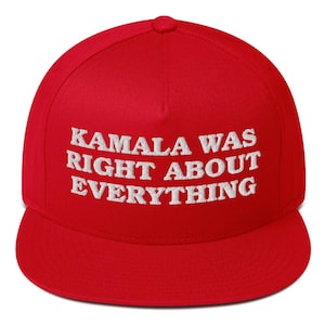 May include: A red, flat-brimmed baseball cap with the embroidered text "KAMALA WAS RIGHT ABOUT EVERYTHING" in white. The cap has a structured fit and a rounded crown.