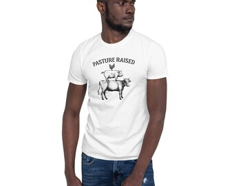 May include: A white t-shirt with the text "PASTURE RAISED" in black lettering. A black and white illustration of a cow, pig, and chicken is below the text.