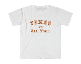 May include: White t-shirt with a brown and orange graphic that says "TEXAS VS ALL Y'ALL" in a collegiate font.