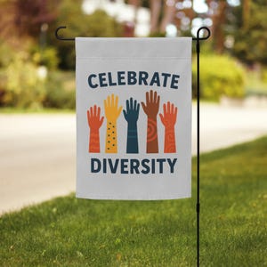 May include: A white garden flag with the text "Celebrate Diversity" in blue letters. Five colorful hands with different skin tones are raised in the air.