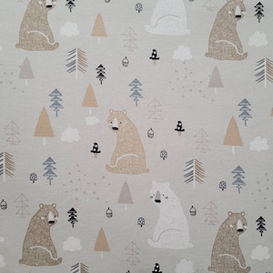 May include: A beige fabric with a repeating pattern of brown bears, white polar bears, and stylized trees. The bears are sitting down and the trees are in various shades of brown and green.