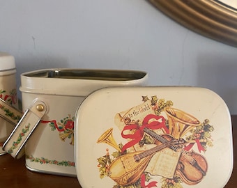 A Set of Two Vintage Christmas Tins with Handles