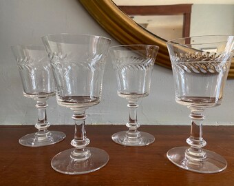 A Set of Four Etched Glass Wineglasses