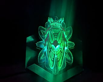 Locust of Harmony.  LED Trippy laser engraved, hand painted pendent